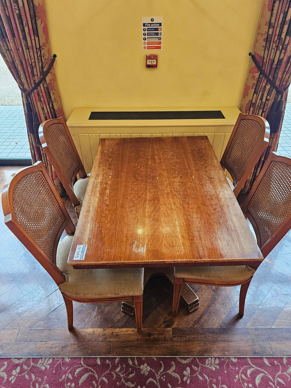 Lot 693: * A hardwood dining table on pedestal 150 x 82 x 73 complete with 4 x cane back upholstered seat pad