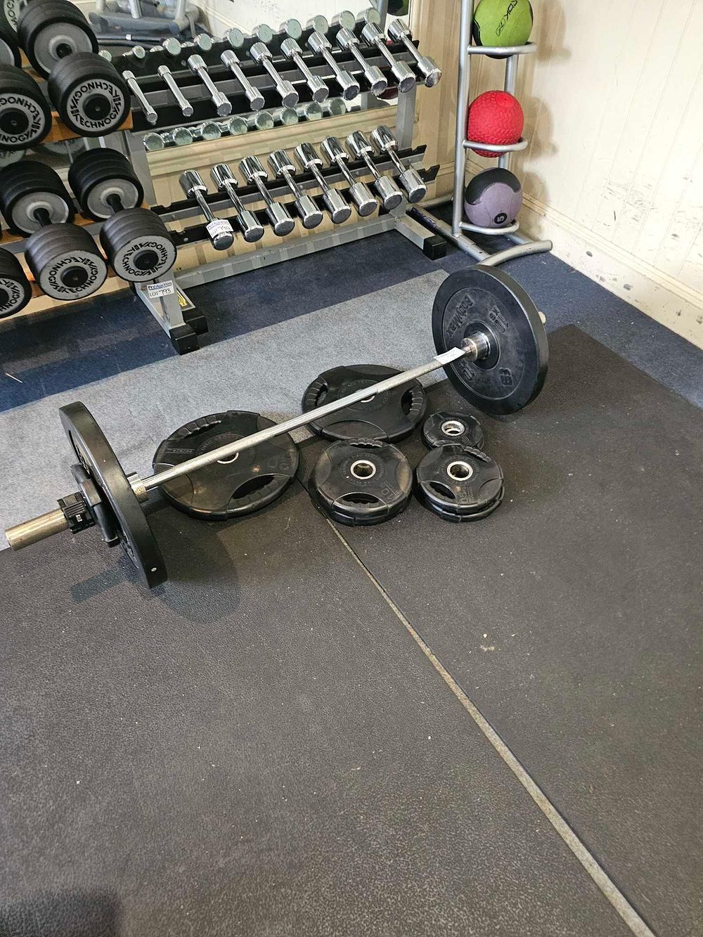 Lot 799: * A Bodypower Olympic Barbell and Weight Plate Set