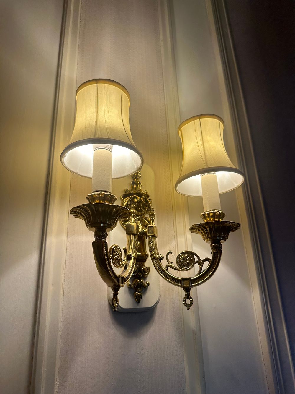 Lot 1215: * Pair of Louis X Style Double-Arm Wall Sconces brass-toned metal