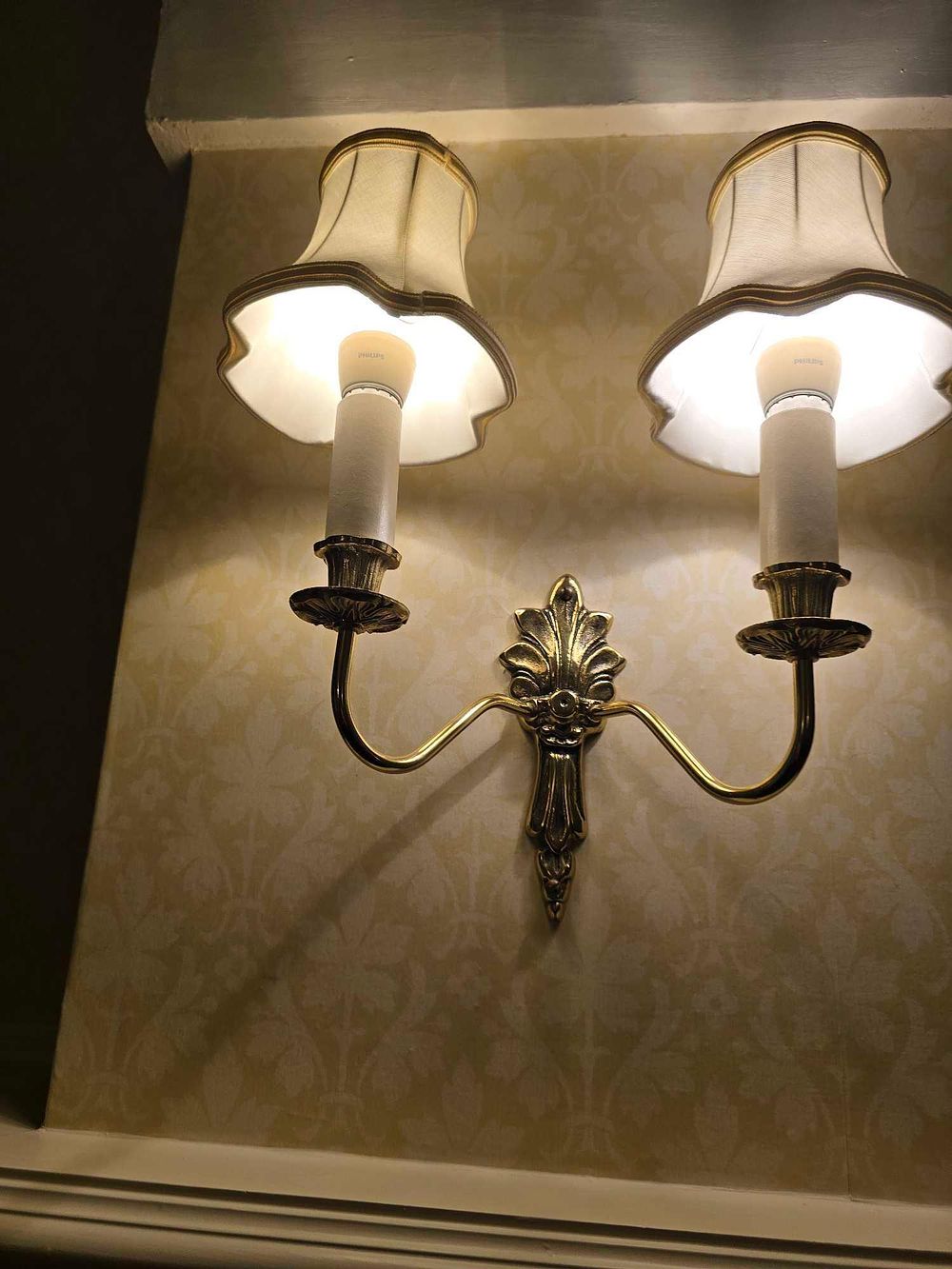 Lot 2118: * Set of three traditional double-arm wall sconces –