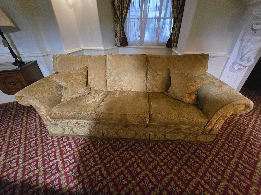 Lot 2157: * A three-seater upholstered sofa in a traditional style
