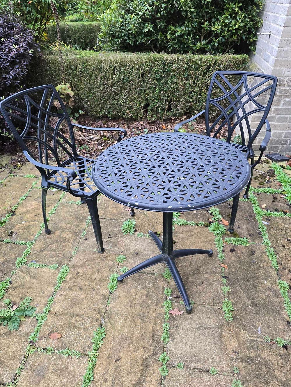 Lot 2289: * A three-piece outdoor bistro set comprising one circular table and two matching chairs