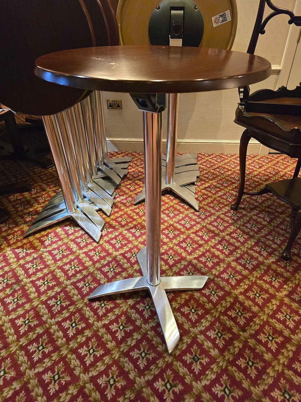 Lot 4023: * 6 x poseur tables, with a round wooden top and a chrome base 70 x 110cm