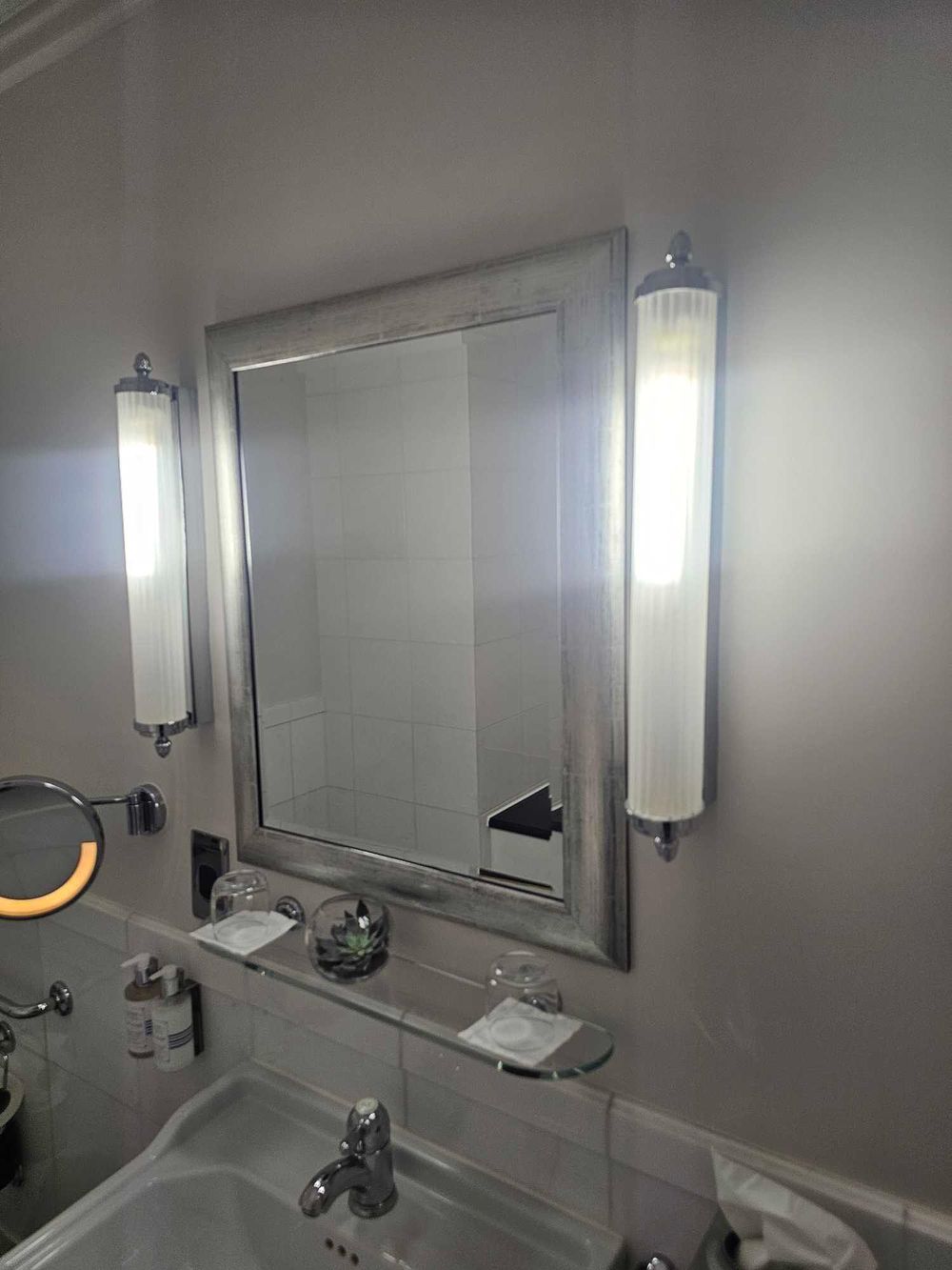 Lot 204: * A rectangular bevelled mirror with a wide brushed silver frame