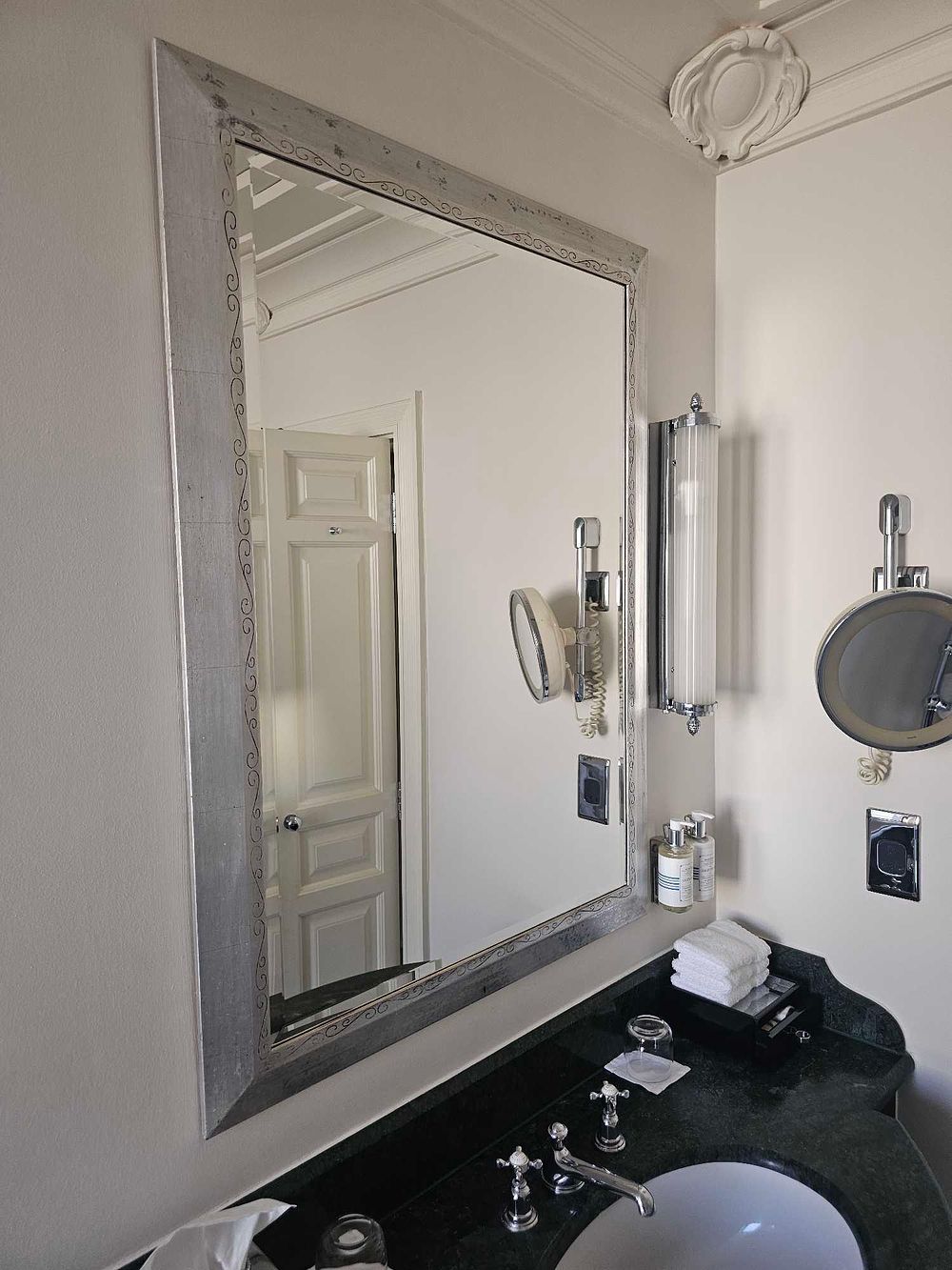 Lot 332: * A rectangular bevelled mirror with a wide brushed silver frame