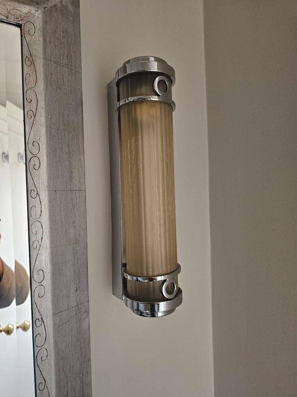 Lot 2137: * A pair of compact, wall-mounted light fitting with a ribbed cylindrical plastic diffuser