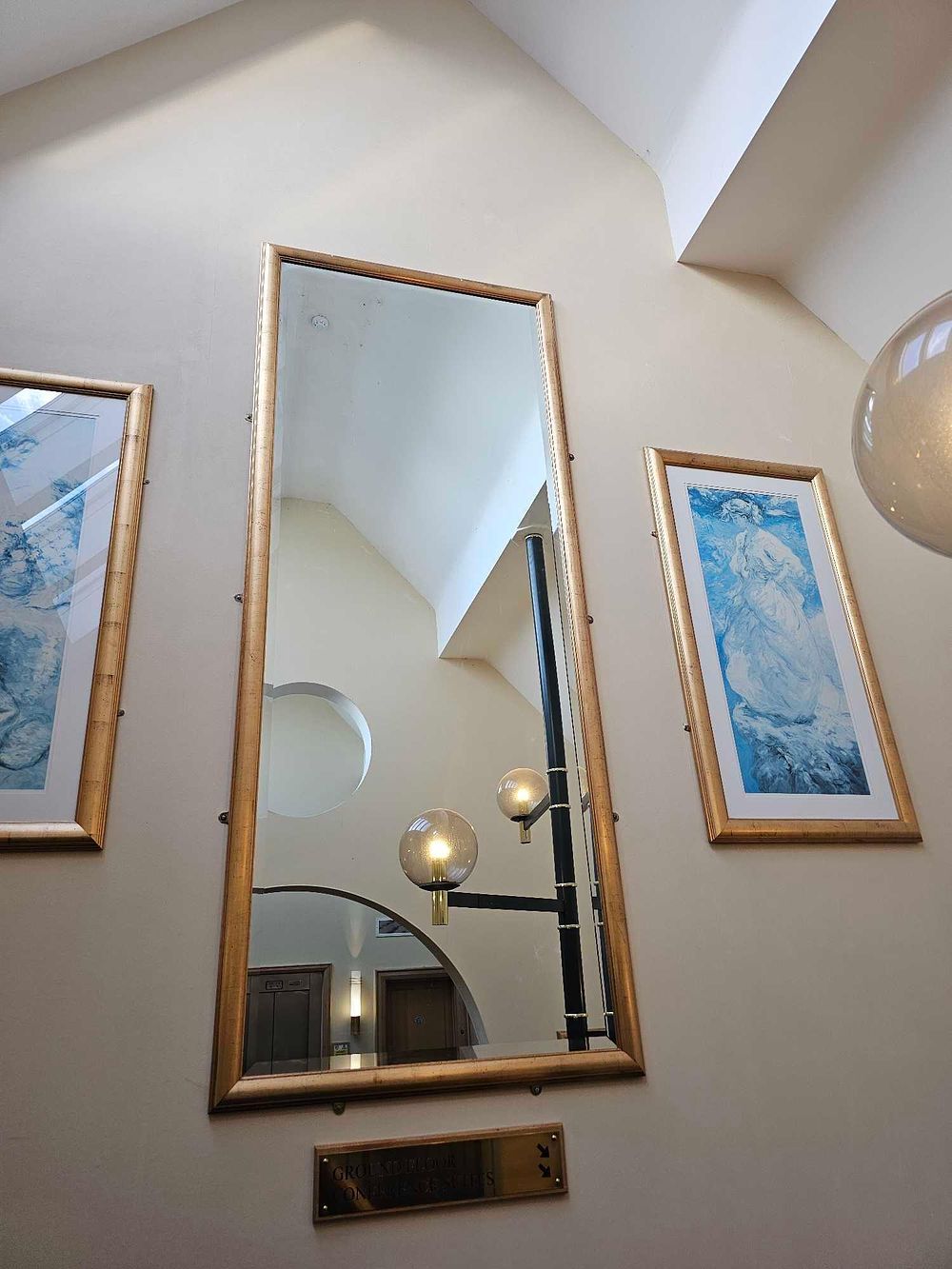 Lot 1074: * A substantial bevelled mirror in gold gilt frame 103 x 255cm