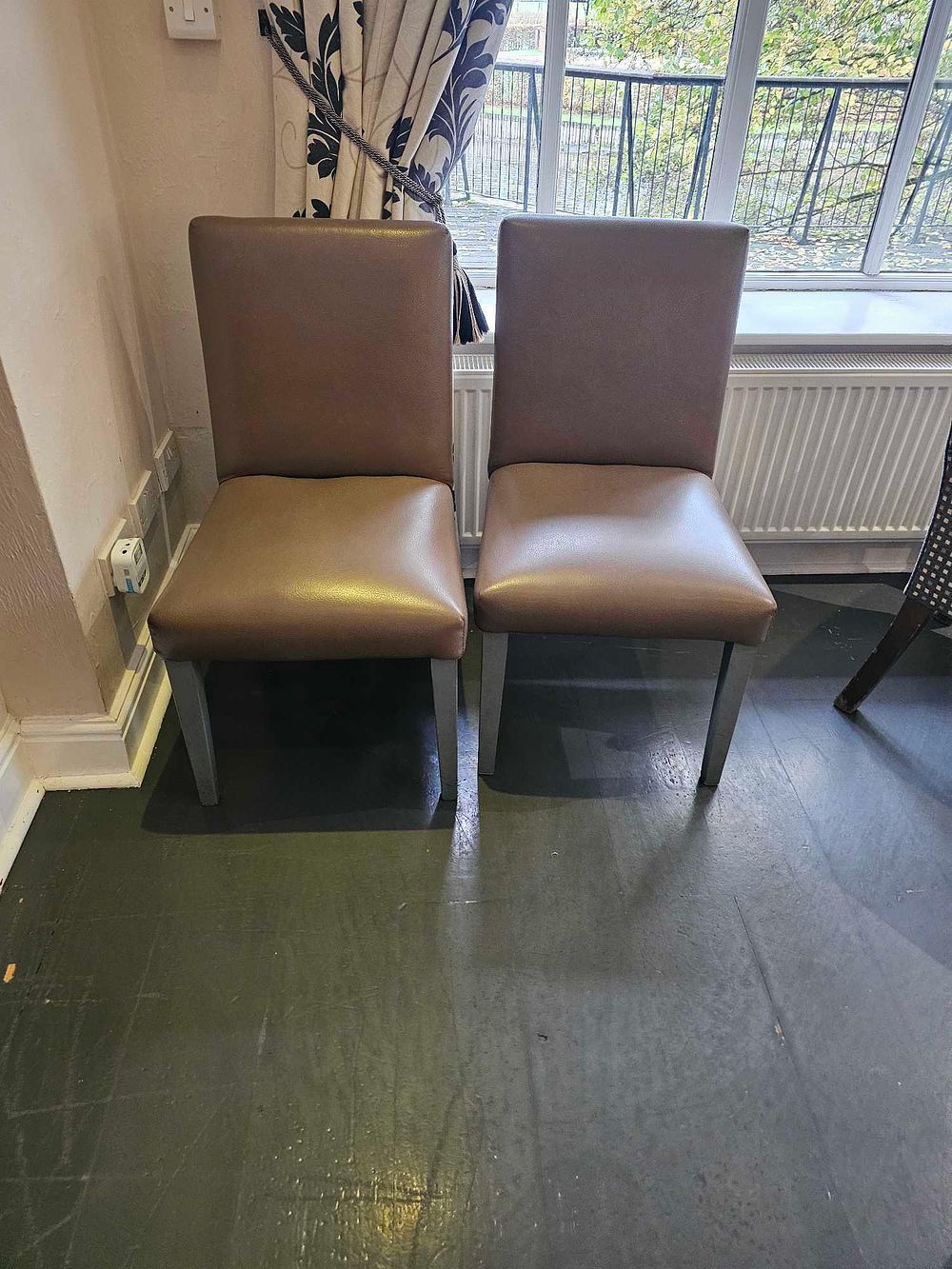 Lot 1102d: * Set of six upholstered dining armchairs with high backs and fixed seat pads Finished in brown vegan