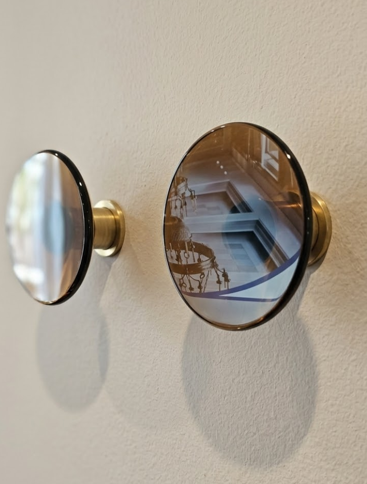 Lot 291: * A Pair of Bespoke "Sea Containers" Amber Glass and Brass Wall Hooks