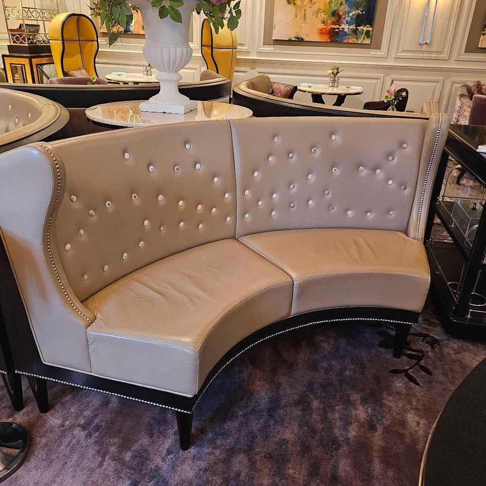 Lot 319: * Curved Banquette Wing Back Sofa –