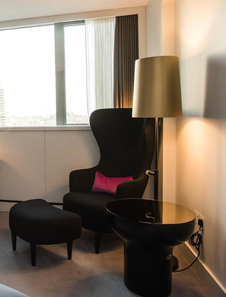 Lot 652: * Tom Dixon Wingback Chair — Royal Purple Tonus with;Footstool