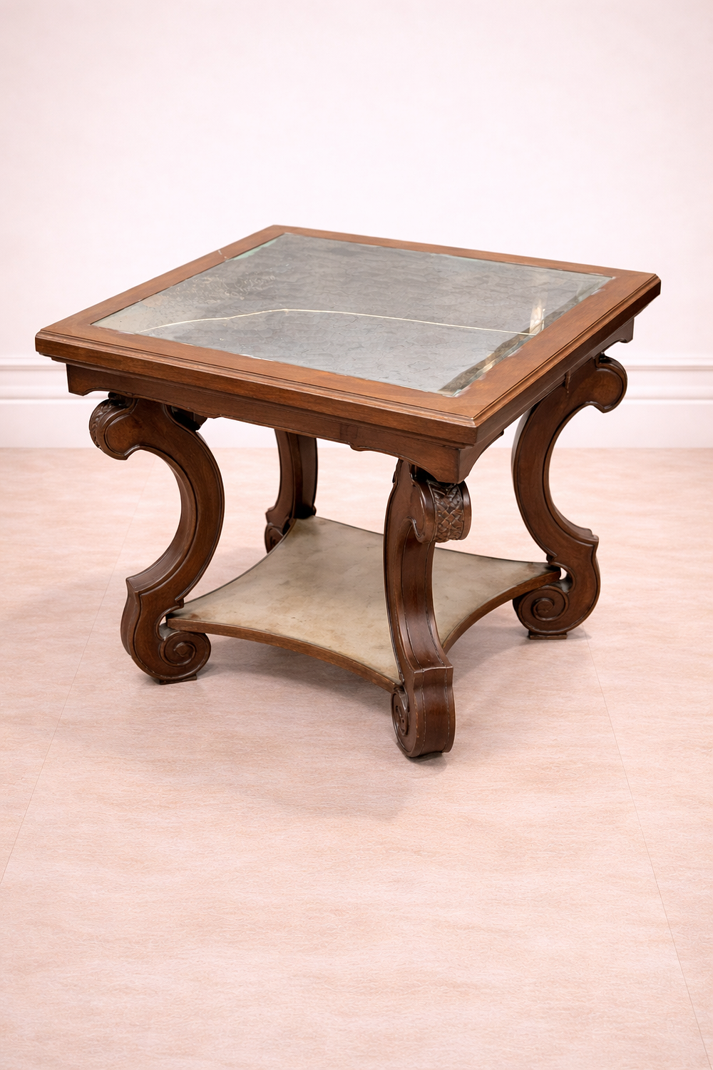 Lot 826: * A mahogany table featuring a square top with an eglomise glass surface and a decorative