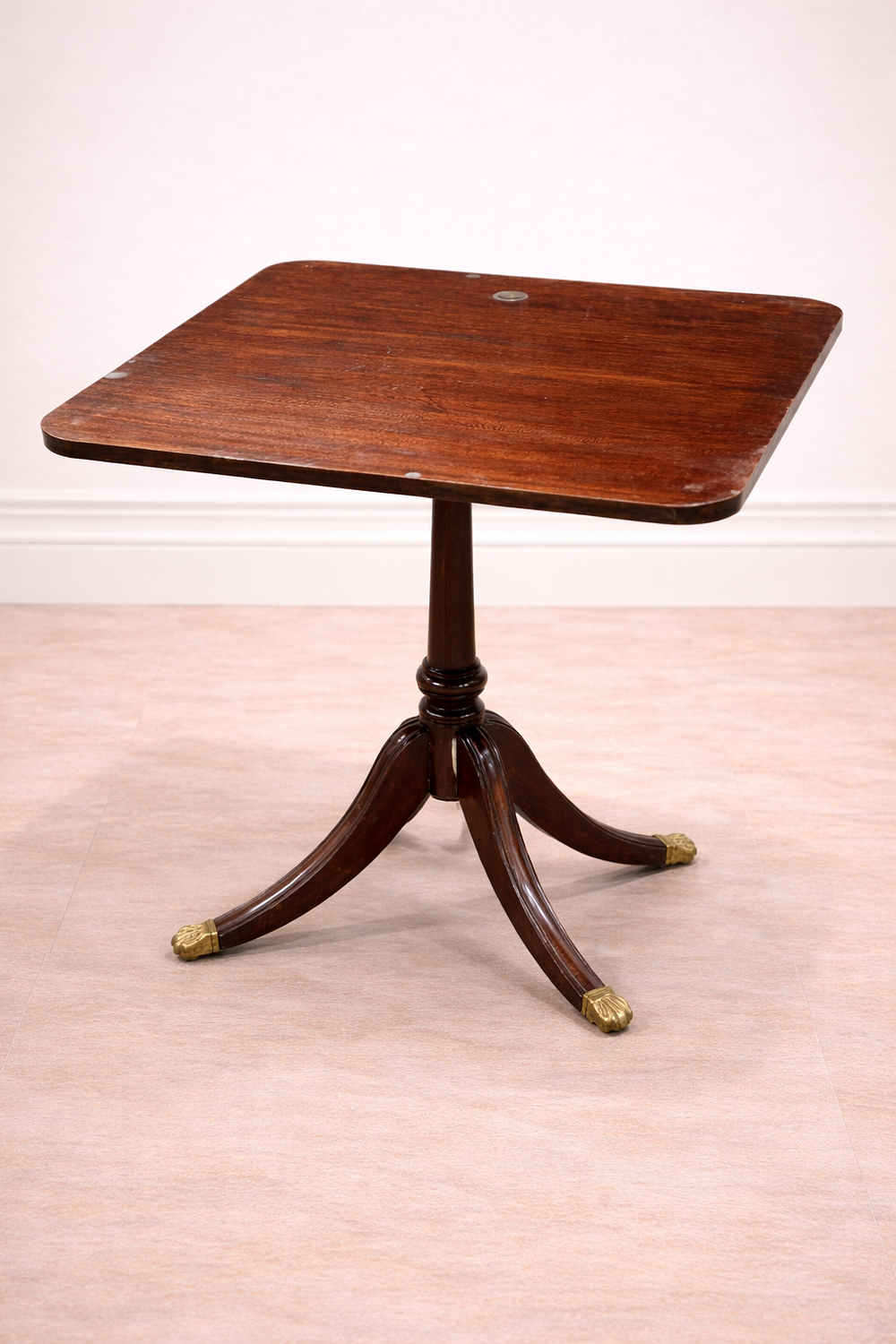 Lot 831: * A mahogany side table featuring a square top with rounded corners and a visible natural grain