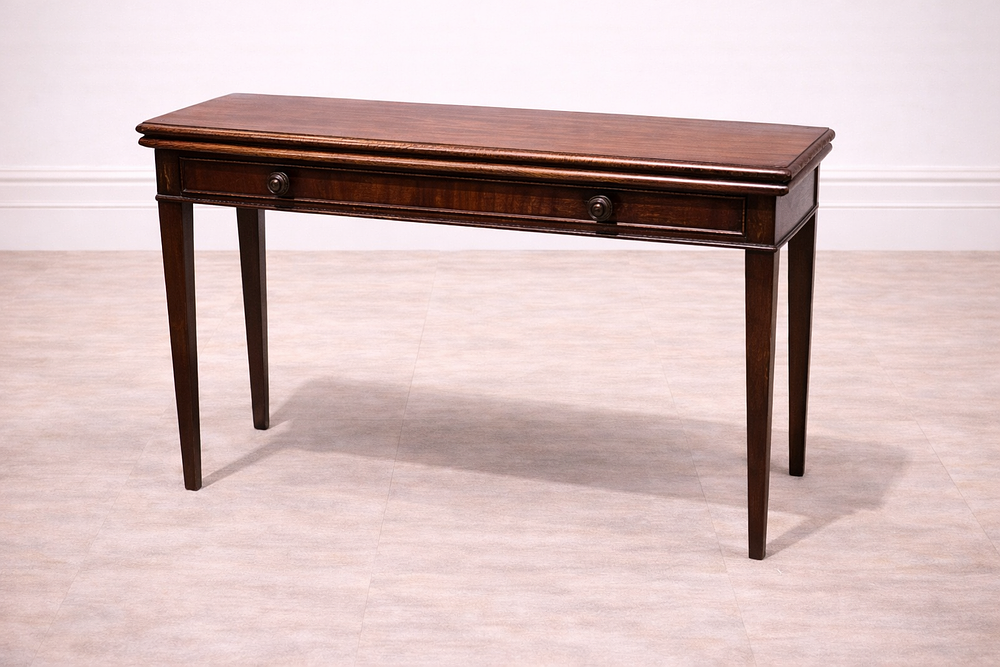 Lot 845: * A mahogany console table featuring a rectangular top with a polished finish and a subtle moulded