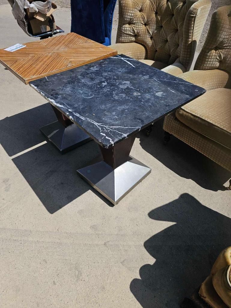 Lot 851: * A dining table featuring a square grey-veined stone top with a polished finish