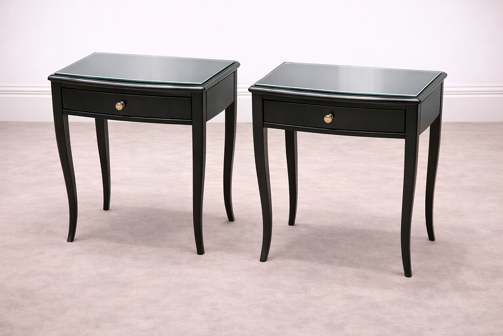 Lot 868: * Pair of RV Astley Maxton bedside tables features a sleek mahogany construction with a deep black