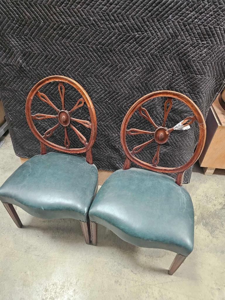 Lot 915: * Pair of George III style wheelback chairs features circular backrests with central carved