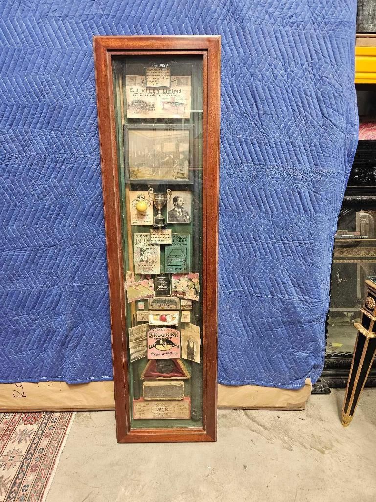 Lot 984: * A tall, vertical shadow box serves as a curated display of vintage memorabilia and advertisements