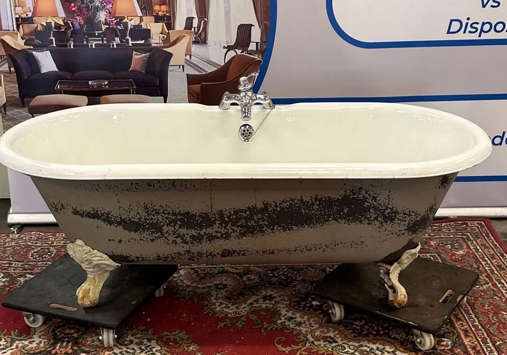 Lot 228: * A White Cast Iron Free Standing Double Ended Roll Top Bath On Claw And Ball Feet 170 x 77 x 60cm