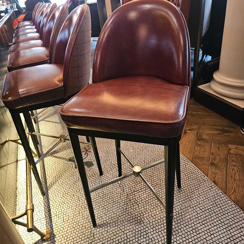 Lot 769: * Bar stool black show wood frame the bucket seat upholstered in leather with a plaid wool wrapped