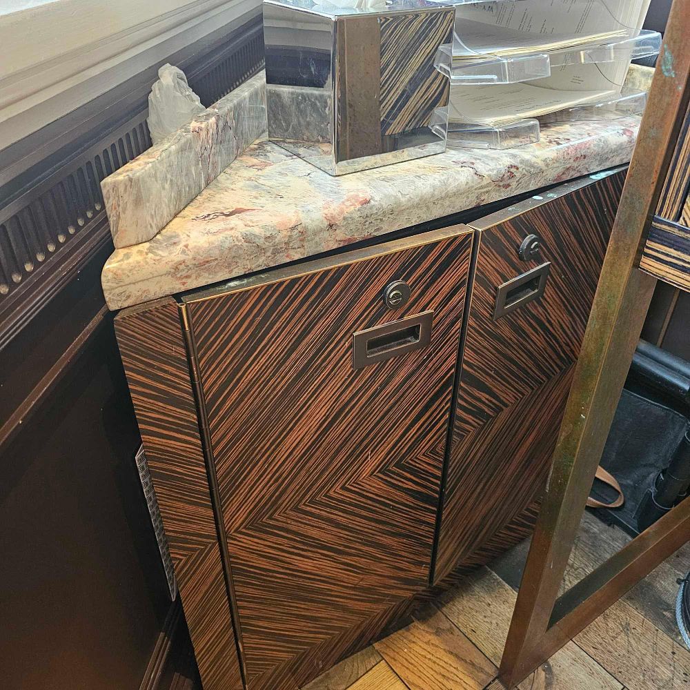 Lot 772: * A marble topped two door corner storage cabinet 68 x 46 x 70cm bespoke for the Cadogan