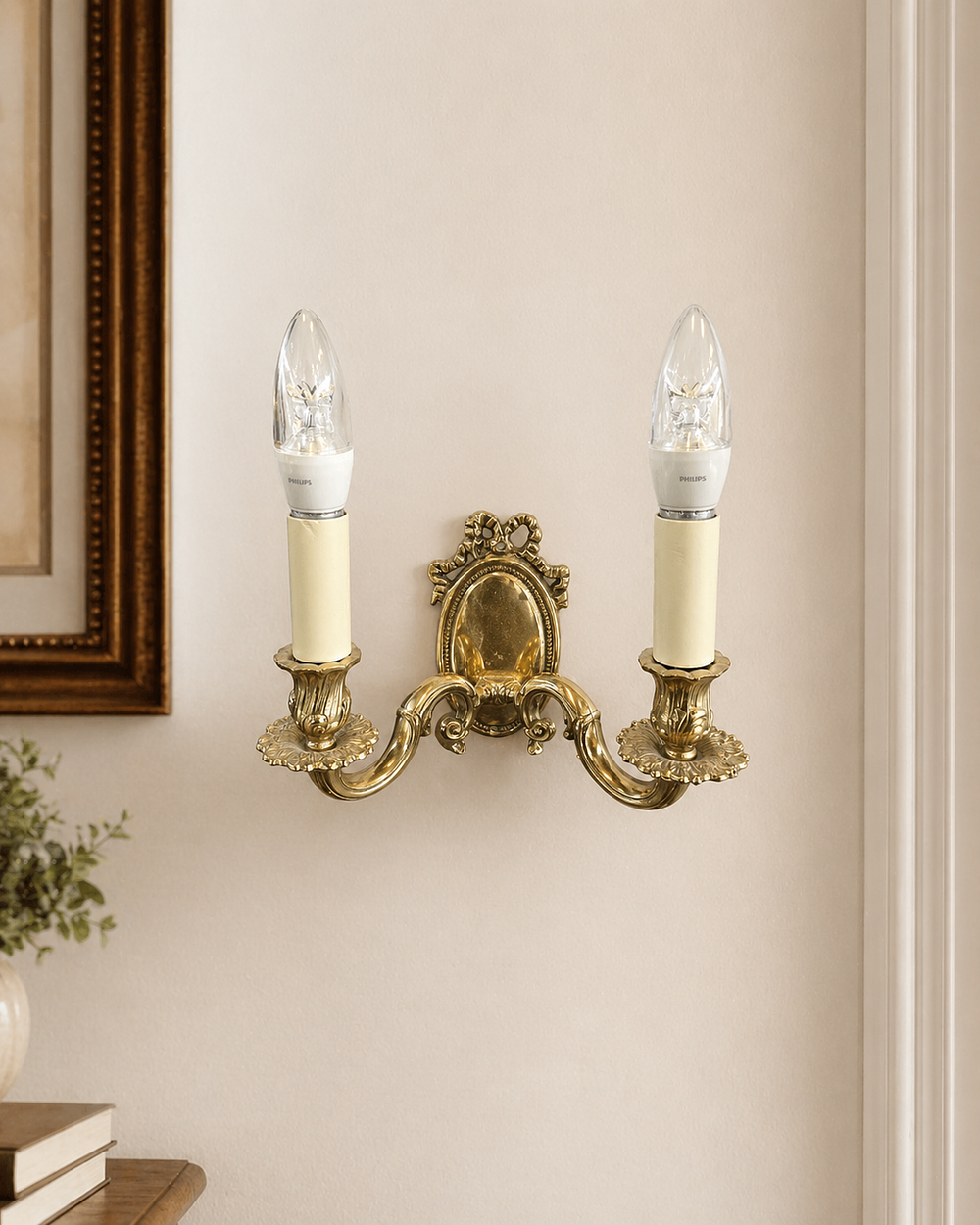 Lot 329a: * A pair of twin-arm wall sconces in a traditional style