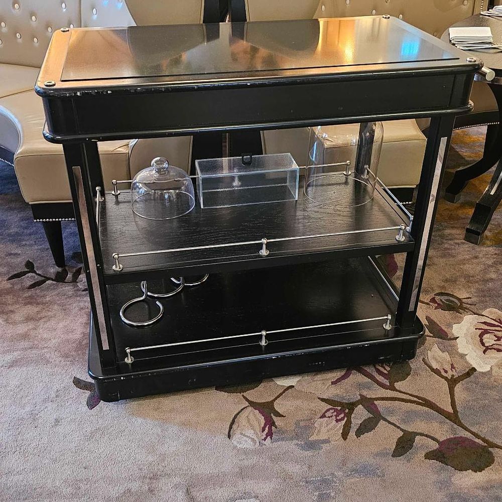 Lot 162: David Thompson ebony wood three-tier cheese trolley