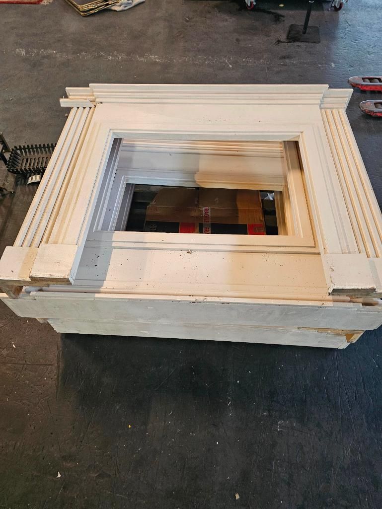 Lot 243: 4 x wooden fireplace surrounds with 4 brass fire guards and 1 marble back surround