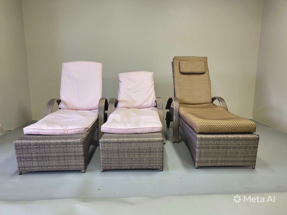 Lot 303: A set of three woven rattan lounge sun beds designed for outdoor or conservatory use
