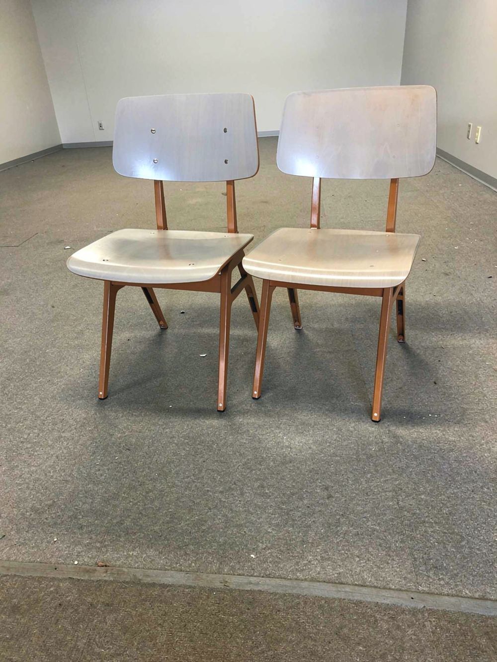 Lot 315: A pair of Dutch industrial-style stacking utility chairs