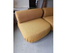 Lot 391: Boucle Mustard armless lounge chair upholstered in a rich mustard tonal bouclé fabric