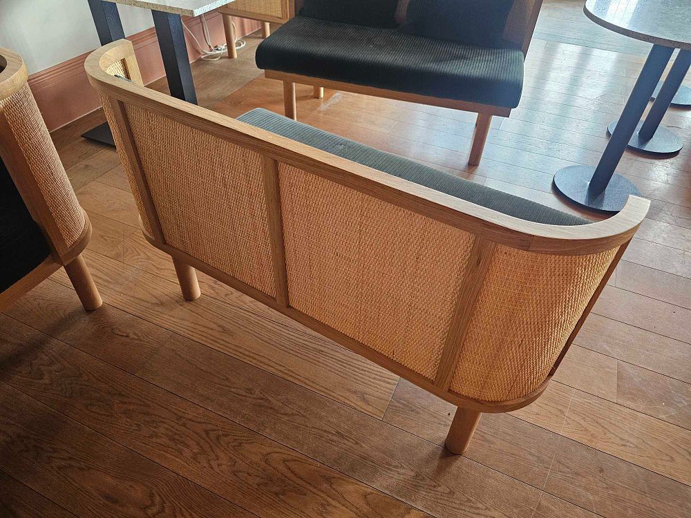 Lot 410: A Pair of Bespoke Rattan and Corduroy Booth Benches
