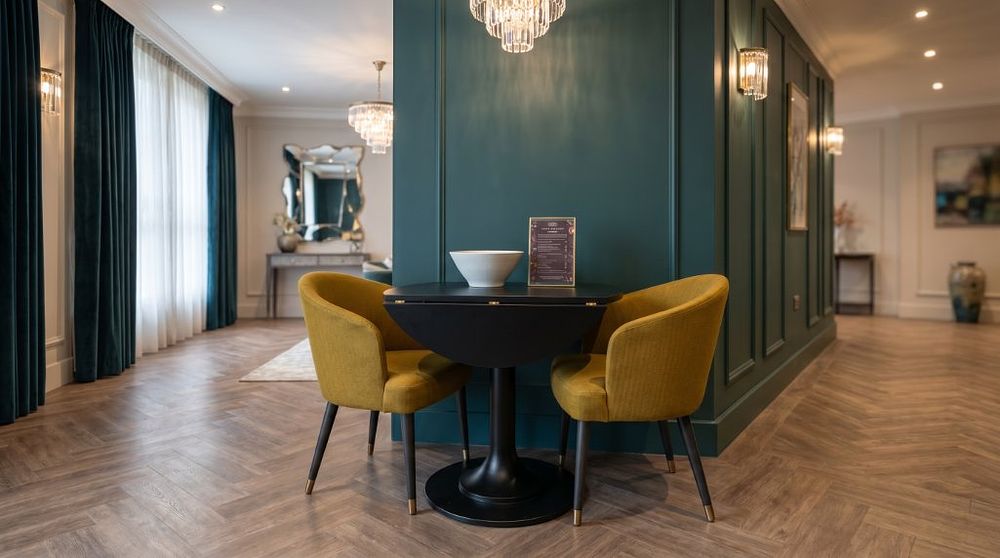 Lot 426: Curtis Furniture Space-Saving Drop Leaf Dining Table with Two Gold 'Emi' Tub Chairs Maximise your