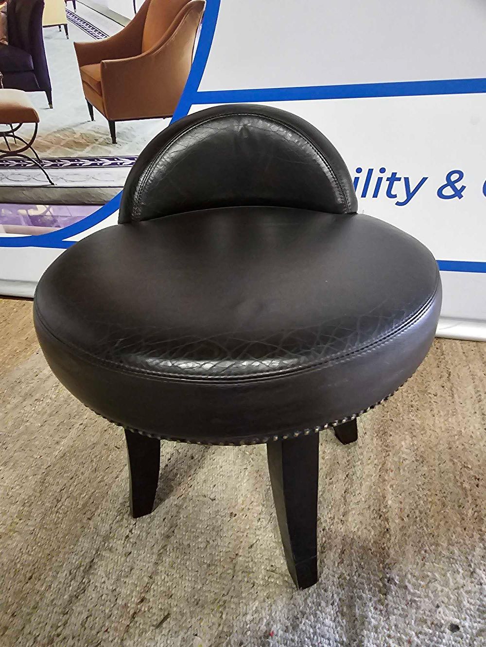 Lot 1190: Bespoke Pure CF Black Leather Low Stool for Kerridge's Bar & Grill, Corinthia London