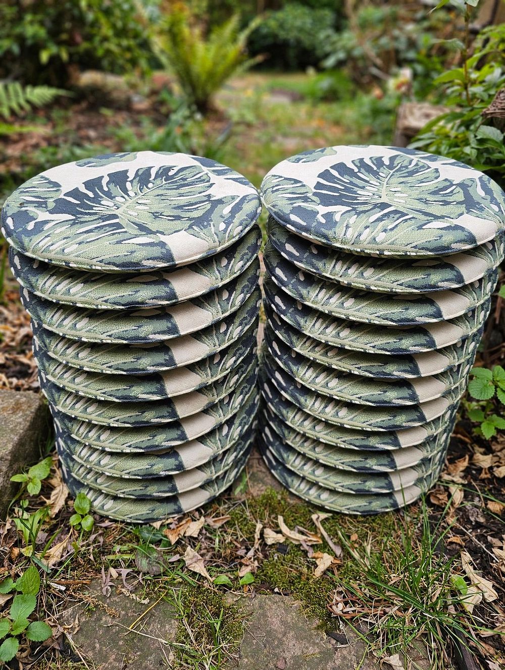Lot 728: A lot consisting of twenty green indoor circular chair pad cushions