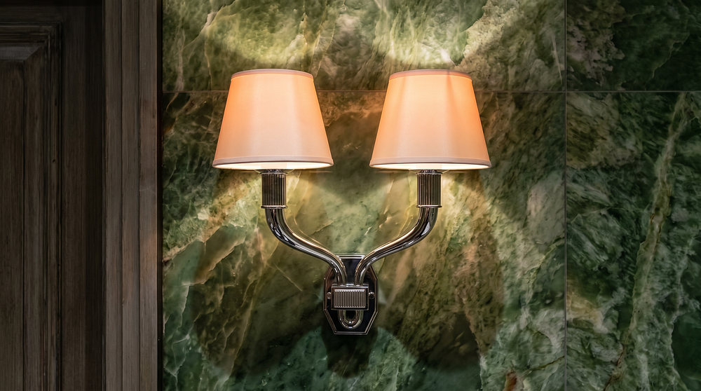 Lot 1546: A Pair of Contemporary Art Deco Style Polished Nickel Twin-Arm Wall Sconces