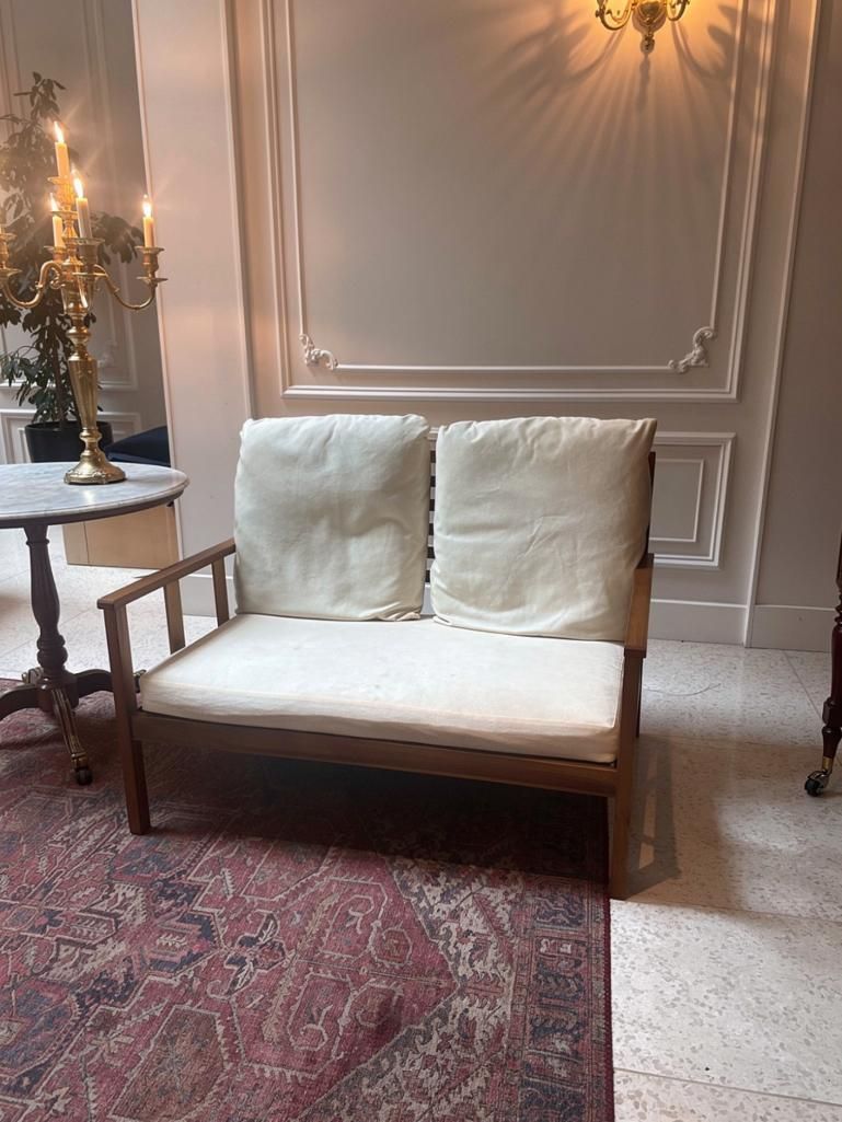 Lot 434: A Two-Seater Outdoor Lounge Sofa