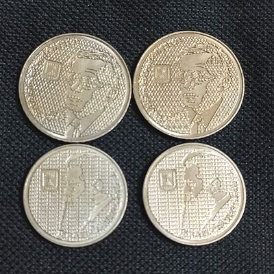 שני מטבעות של עשרה שקלים הרצל ושני מטבעות מאה שקלים ז'בוטינסקי
