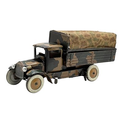 Military Truck as Lithographed Tin Toy in Camouflage with Clockwork Drive and Lighting. Lithograp 