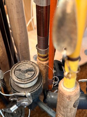 An Assortment of Vintage and Contemporary Fishing Rods, Reels, and Speargun with Tackle Box. An 