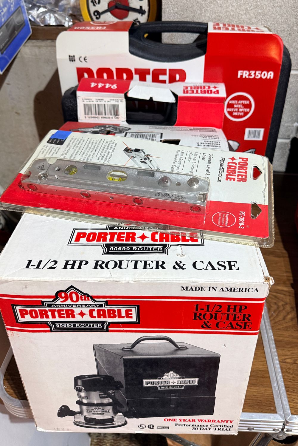 A Collection of Five Porter-Cable Power Tools and Accessories including 90th Anniversary Router Kit