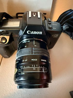 An Assortment of Canon EOS 650 35mm SLR Camera Equipment and Accessories. This lot consists of a 