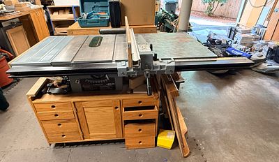 Delta 10 Inch Contractor Saw with Unifence System and Custom Hardwood Cabinet. This lot features 