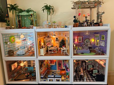 A Collection of Miniatures in Rolife Super Creator Modular Room Boxes. This group consists of an 