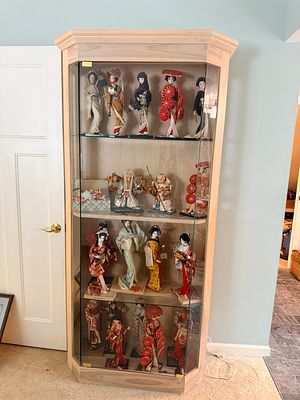 A Large Collection of Yamaha Traditional Japanese Ningyo Dolls in a Custom Hardwood Display Cabinet