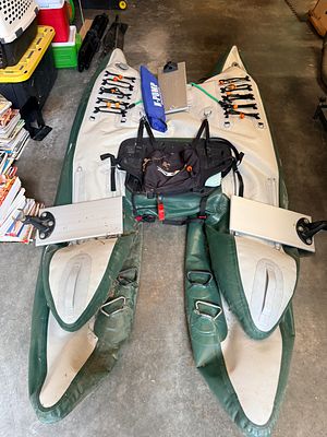 NRS GigBob Personal Inflatable Frameless Fishing Watercraft with outboard motor. This is an NRS 