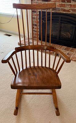 Conant Ball Oak Fan-Back Windsor Rocking Chair. A 20th-century rocking chair manufactured by the 