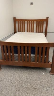 Wooden Bed Complete with Clean Brooklyn Bedding. mattress
