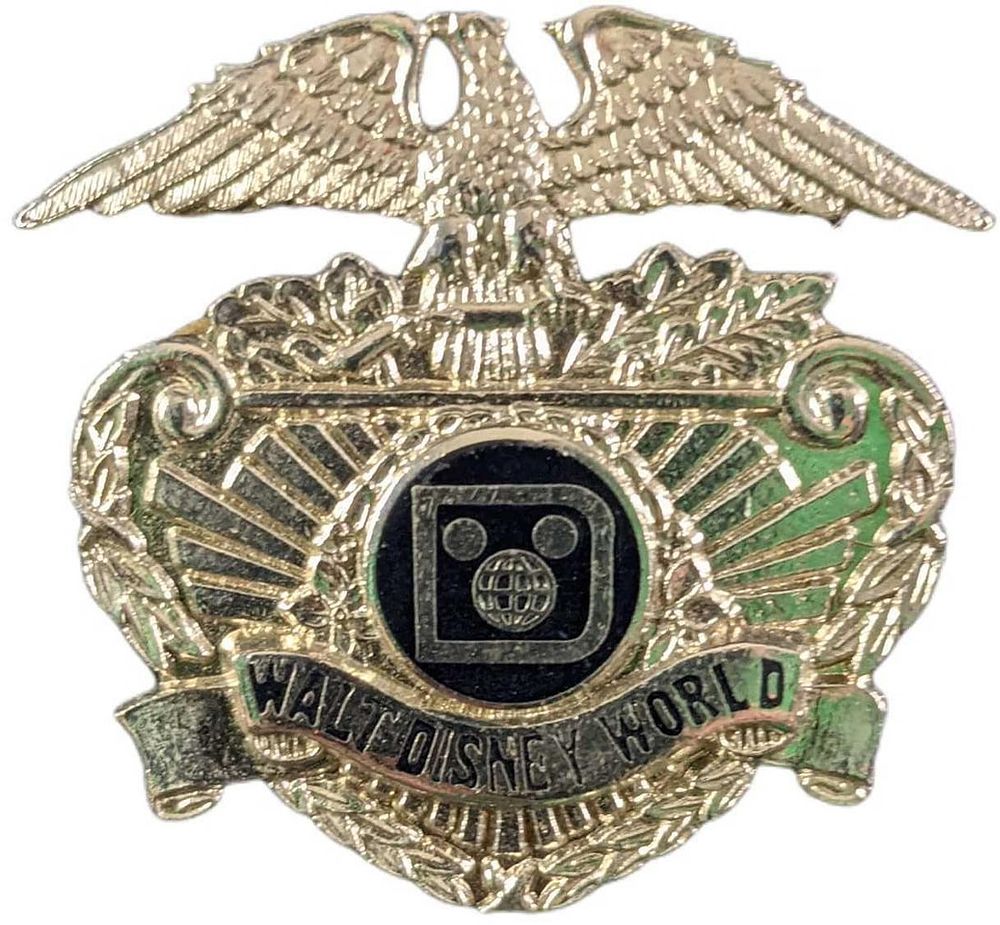 Lot 88: Early 1980s Disney World Female Security Metal Hat Badge
