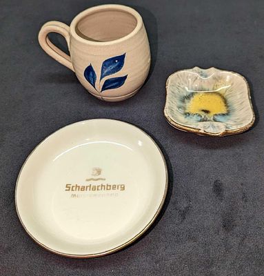 Vintage Porcelain Ashtrays And Pottery Mug. This lot contains: 
(1) Williamsburg Pottery Mug. 
